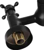 Close-up of a black faucet with a brass threaded fitting. Produktbild-Vorschau