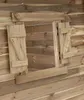 A close-up view of wooden shutters on a wooden structure. Produktbild-Vorschau