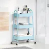A light blue three-tier storage cart filled with bathroom accessories in a bathroom setting. Podgląd zdjęcia produktu