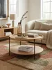 Couchtisch aus Eichenholz in einem hellen Wohnzimmer mit stilvoller Dekoration auf einem modernen Teppich vor einem Sofa._#sku_BARWL6.491# Produktbild-Vorschau