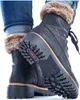 A close-up shot of a pair of black Rieker women's lace-up boots with fur trim, worn with blue jeans. Anteprima dell’immagine prodotto