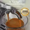 Espresso being extracted from an espresso machine into a glass. Náhled obrázku produktu