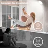 A split image showing a woman enjoying a bright room with a floor lamp and a sad woman sitting in a dark room. The top image depicts a woman taking a selfie in a well-lit room with a floor lamp, symbolizing happiness. The bottom image shows a woman looking Produktbild-Vorschau