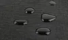 Close-up of water droplets on a black textured fabric. Náhľad obrázku produktu