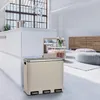 A modern kitchen or living area with a multi-compartment trash can in the foreground. Produktbild-Vorschau