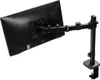 A black monitor arm clamped to a desk surface, with a monitor attached to the arm. Podgląd zdjęcia produktu