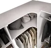 Interior view of a white closet with shelves and hanging clothes. Produktbild-Vorschau