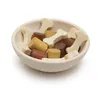 A wooden bowl filled with wooden dog food pieces shaped like bones and cylinders. Produktbild-Vorschau