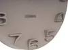 A close-up view of a wall clock face with raised numbers and the brand name. Anteprima dell’immagine prodotto