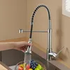 A hand is shown rinsing fruit under a kitchen faucet. Produktbild-Vorschau