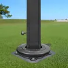 Close-up of a dark gray umbrella base stand on a green lawn with a blue sky in the background. Náhľad obrázku produktu
