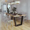 A dining room scene with a wooden table and chairs, set for a meal. Anteprima dell’immagine prodotto