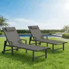 Two grey lounge chairs are set up on a green lawn next to a swimming pool on a sunny day. Produktbild-Vorschau