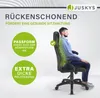 A man is sitting in a black and violet office chair, demonstrating its ergonomic features. Náhled obrázku produktu