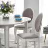 A dining table with chairs and a flower arrangement. Náhľad obrázku produktu