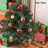 A small, decorated artificial Christmas tree surrounded by wrapped gifts. Produktbild-Vorschau