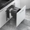 A kitchen cabinet with a pull-out trash bin system. Produktbild-Vorschau