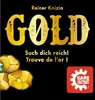 The image is a marketing graphic for the board game 'Gold' by Reiner Knizia. It features the game title in large gold lettering, along with German and French taglines, and an illustration of gold nuggets. A 'Game Factory' logo is also present. Anteprima dell’immagine prodotto