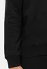 A close-up view of a black hoodie, showing the sleeve, pocket, and waistband. Produktbild-Vorschau