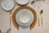 A table setting with plates, cutlery, and a glass. Náhľad obrázku produktu