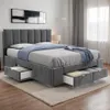 A bedroom scene featuring a bed with storage drawers. Produktbild-Vorschau