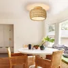 A dining area with a round table, chairs, and a ceiling light. Produktbild-Vorschau