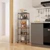 A kitchen scene with a metal shelving unit holding various kitchen items. Produktbild-Vorschau