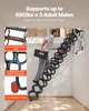A man is climbing a foldable attic ladder that is installed in a ceiling opening. Anteprima dell’immagine prodotto