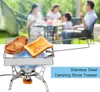 A family is having a picnic outdoors, with a portable camping stove and toaster in the foreground. Náhľad obrázku produktu