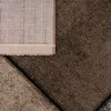 A close-up view of the corner of a rug, showing the texture and the backing. Produktbild-Vorschau