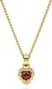 A close-up studio shot of a gold necklace with a heart-shaped pendant. Náhľad obrázku produktu