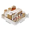 A white organizer tray filled with various food containers, bottles, and boxes. Produktbild-Vorschau