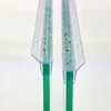 Close-up view of two clear plastic shower door seals attached to green glass. Podgląd zdjęcia produktu