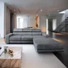 A modern living room with a large sectional sofa and a marble coffee table. Produktbild-Vorschau