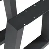 A close-up view of black metal table legs with pre-drilled holes for assembly. Anteprima dell’immagine prodotto