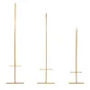 Three gold wedding stands of varying heights are displayed against a white background. Produktbild-Vorschau