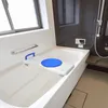 A clean, modern bathroom with a bathtub and a bath seat. Náhled obrázku produktu