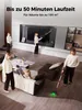 A modern living room scene with multiple people using a cordless vacuum cleaner. Produktbild-Vorschau
