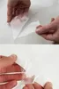 Hands peeling a transparent sheet from a white surface. Produktbild-Vorschau