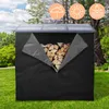 A black cover for a firewood rack filled with firewood, set in a grassy outdoor environment with trees and a blue sky. Náhľad obrázku produktu