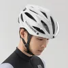 A man wearing a white bicycle helmet. Produktbild-Vorschau