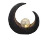 A black crescent-shaped solar lamp with a clear, cracked glass ball in the center, illuminated from within. Anteprima dell’immagine prodotto