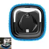 A top-down view of a black and white robot vacuum cleaner with a blue microfiber cleaning pad attached. Produktbild-Vorschau