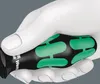 A close-up shot of a white mannequin hand holding a black screwdriver with green accents. Produktbild-Vorschau