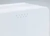 A close-up view of a white bread box with a series of small holes on its side. Náhled obrázku produktu