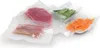 Vacuum-sealed food items including meat, fish, green beans, and shredded carrots. Produktbild-Vorschau