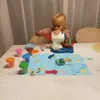 A young girl is playing with a toy. Anteprima dell’immagine prodotto