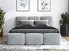 A modern bedroom setting with a bed, pillows, and decorative plants. Produktbild-Vorschau