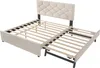 A beige upholstered bed frame with an extended trundle bed, both showing their wooden slatted bases. Náhled obrázku produktu