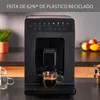 A black KRUPS espresso machine is shown on a kitchen counter, with a cup of espresso in front of it. Voir les images du produit